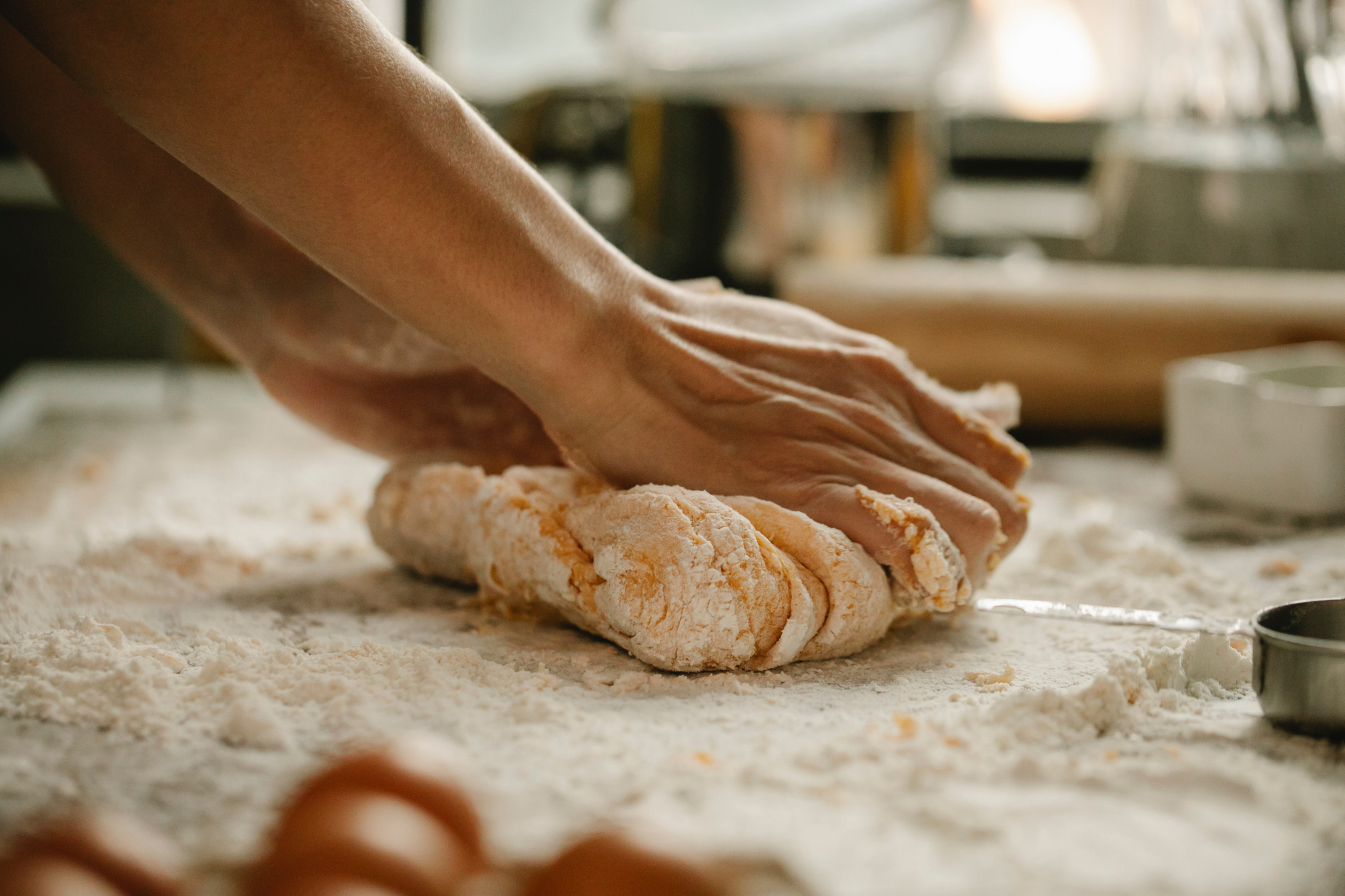 Baker Kneading Dough in Preparation for Baking